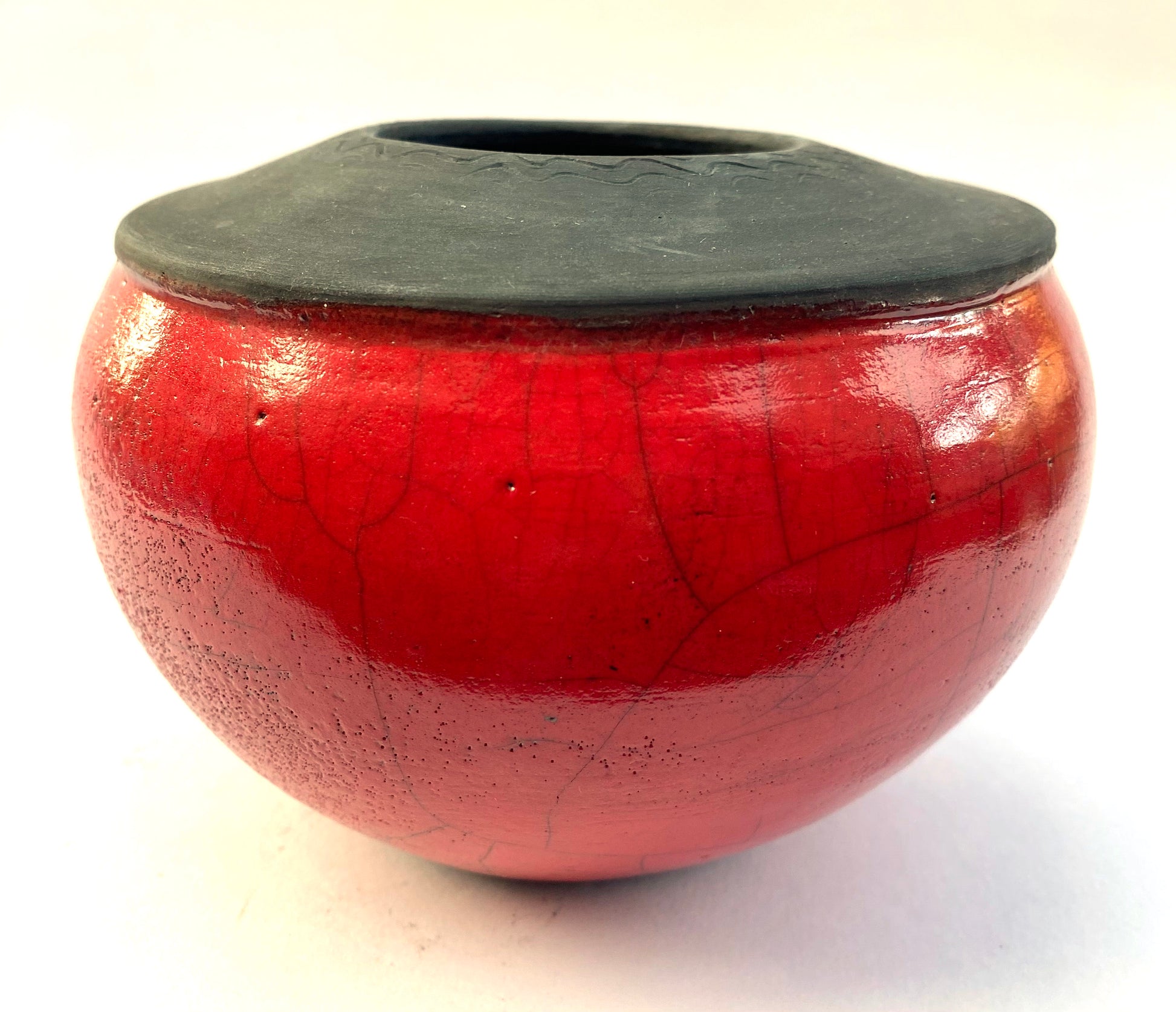Poppy seed head inspired round red pot