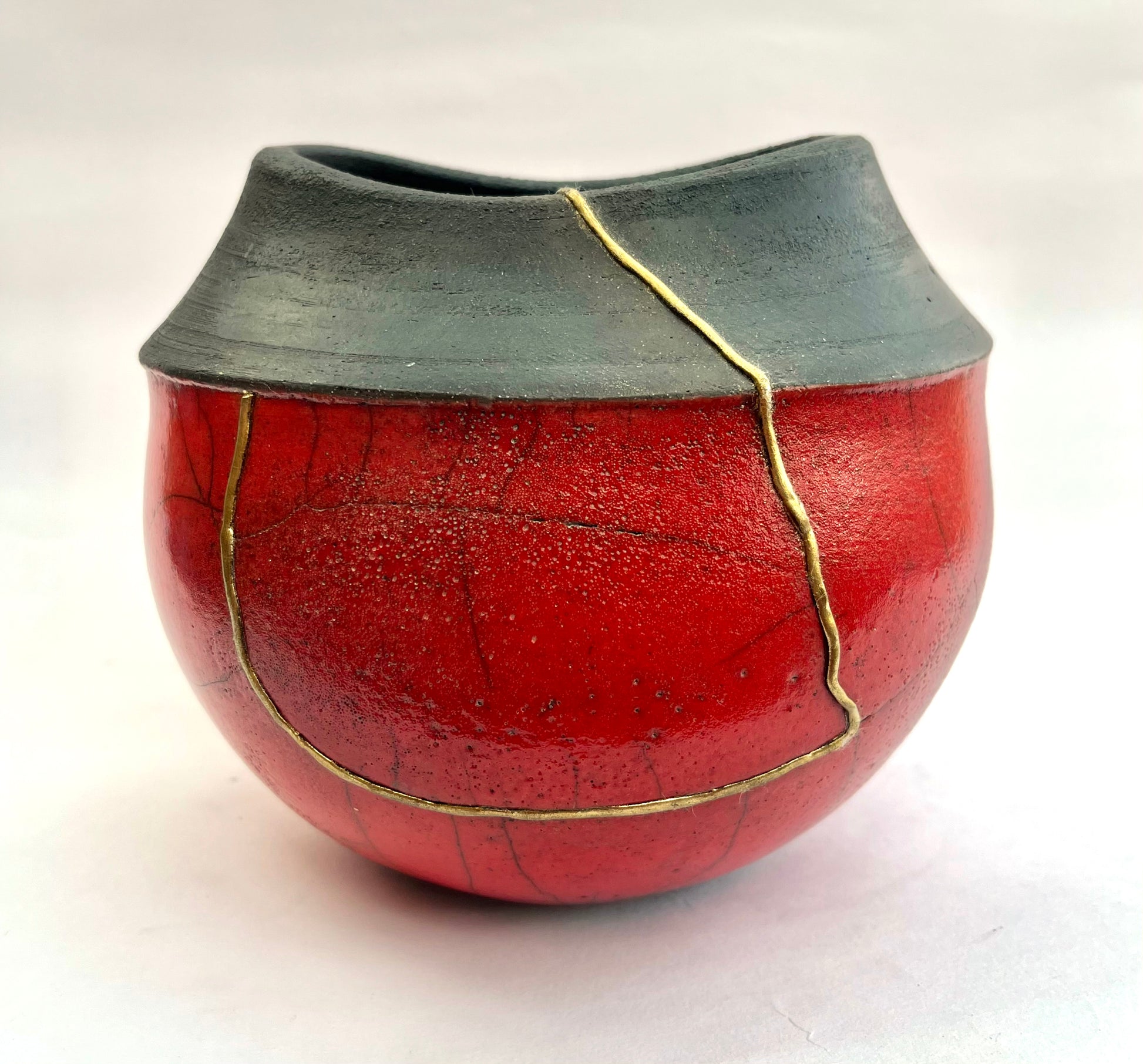 Red kintsugi raku pot