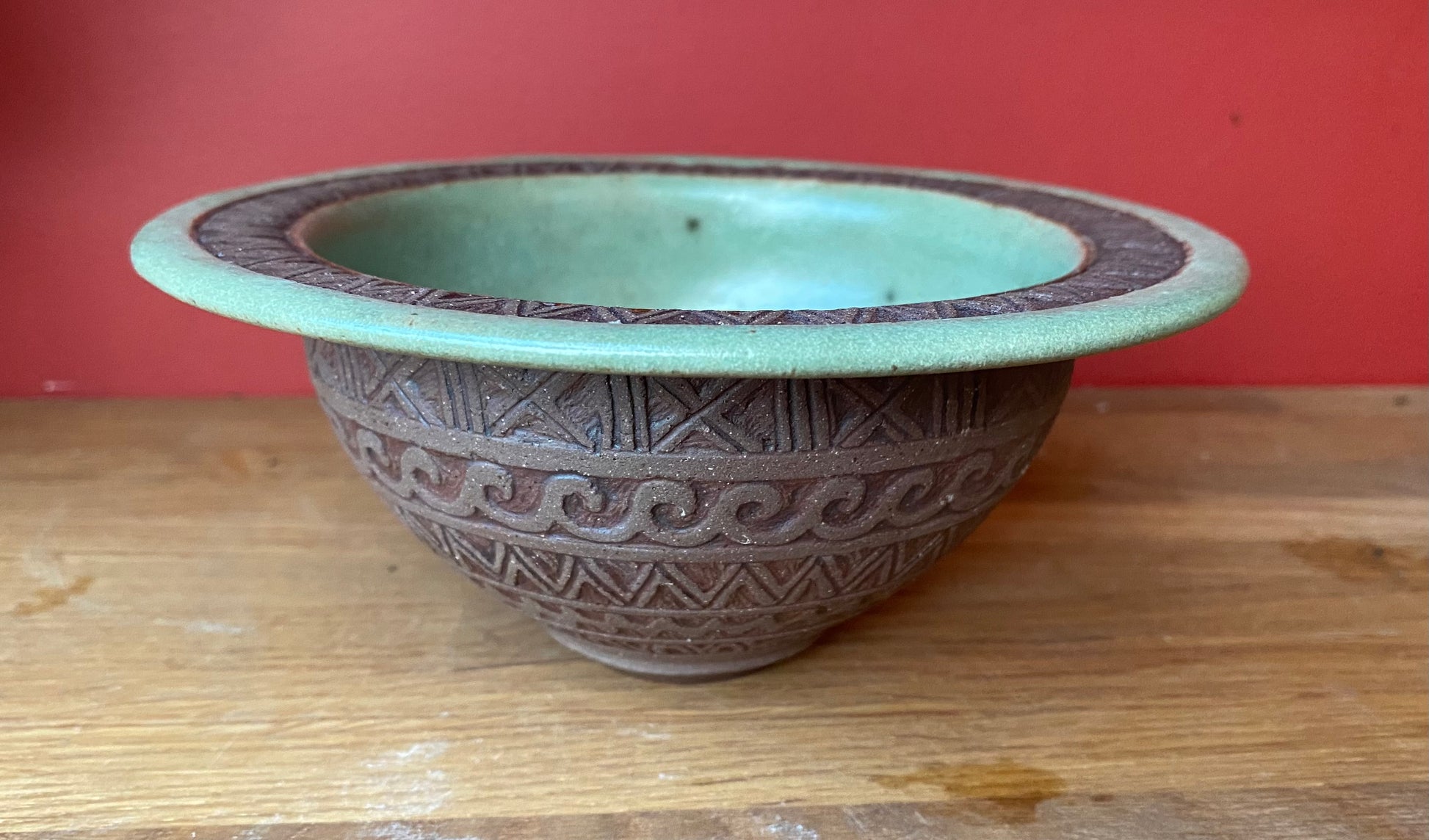 Stoneware bowl with hand drawn inlaid concentric scraffito markings.  h 7, w 17