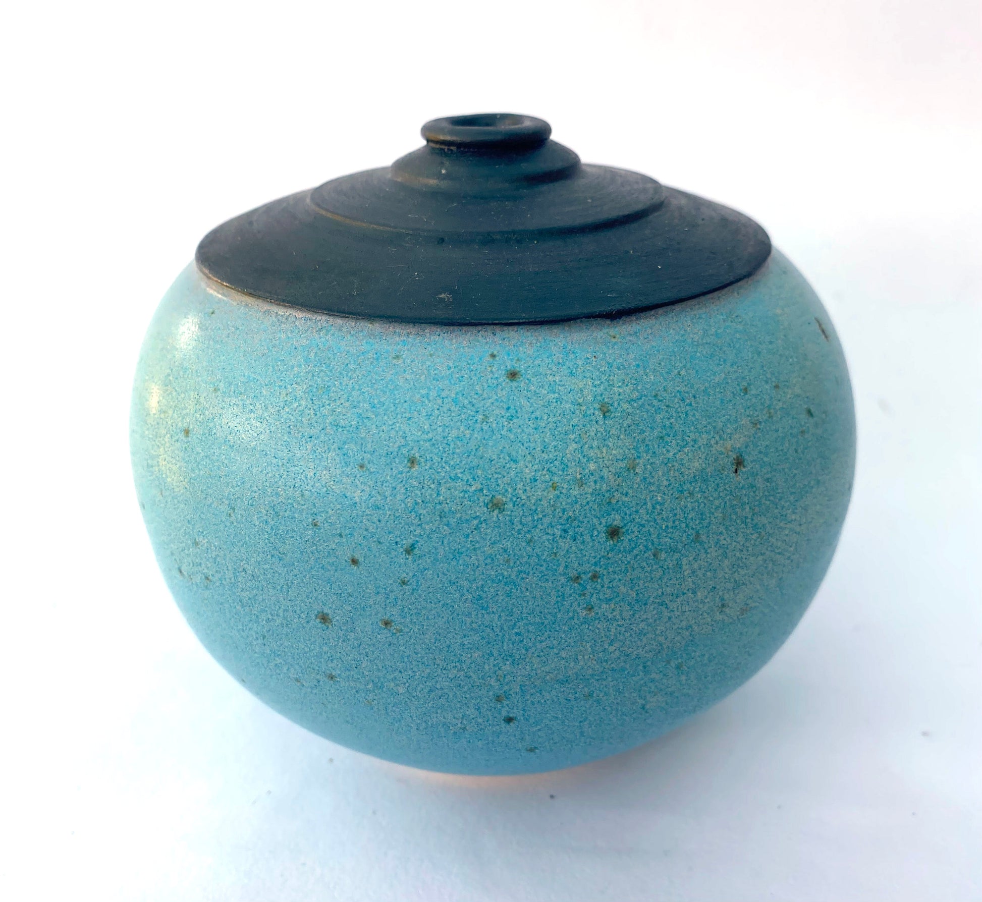 Speckled turquoise and black round bottle