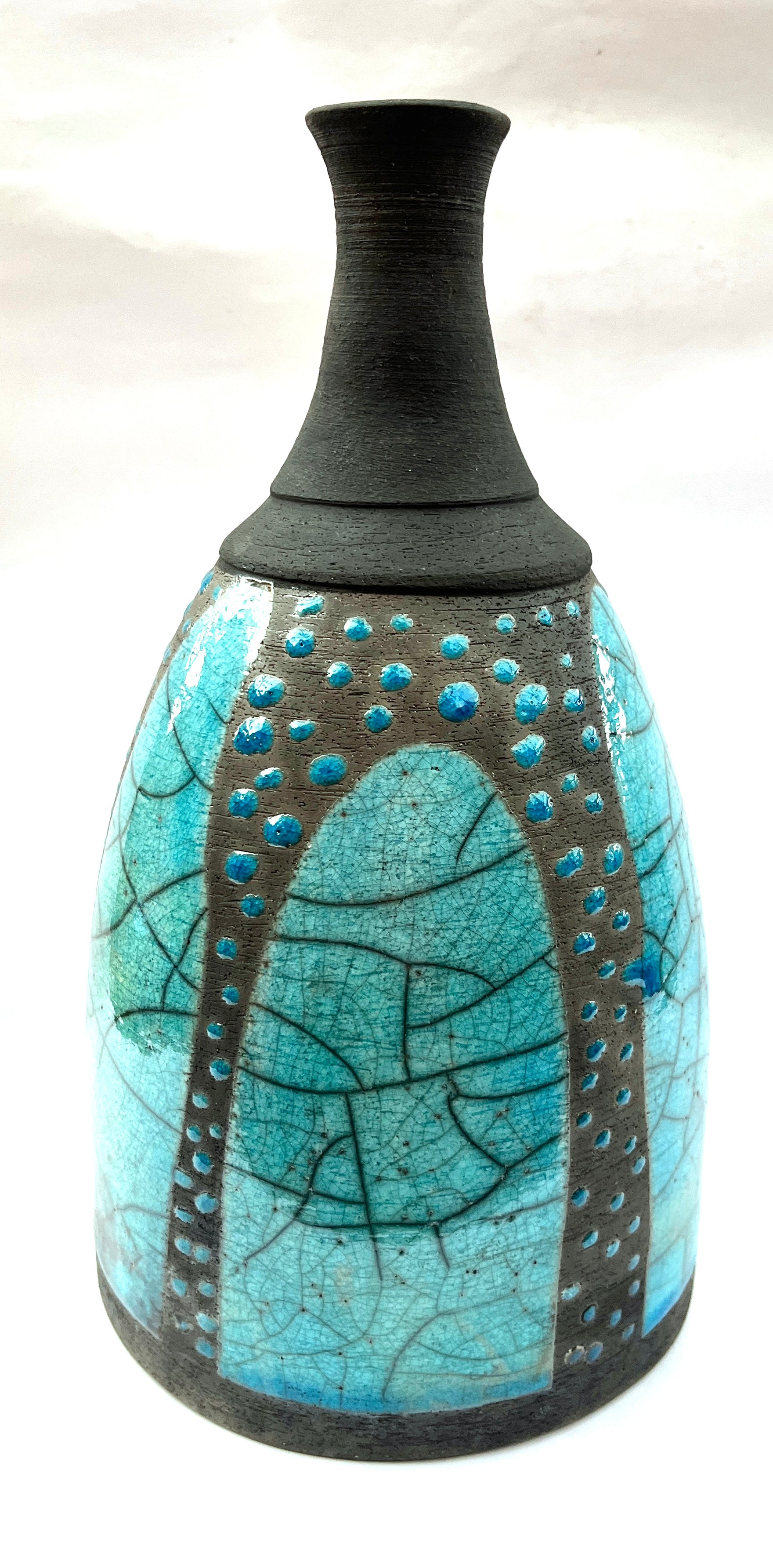 Turquoise raku bottle with poured patterns and dots